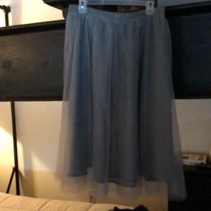 Grey Tulle/grey liner. Never worn/new condition.